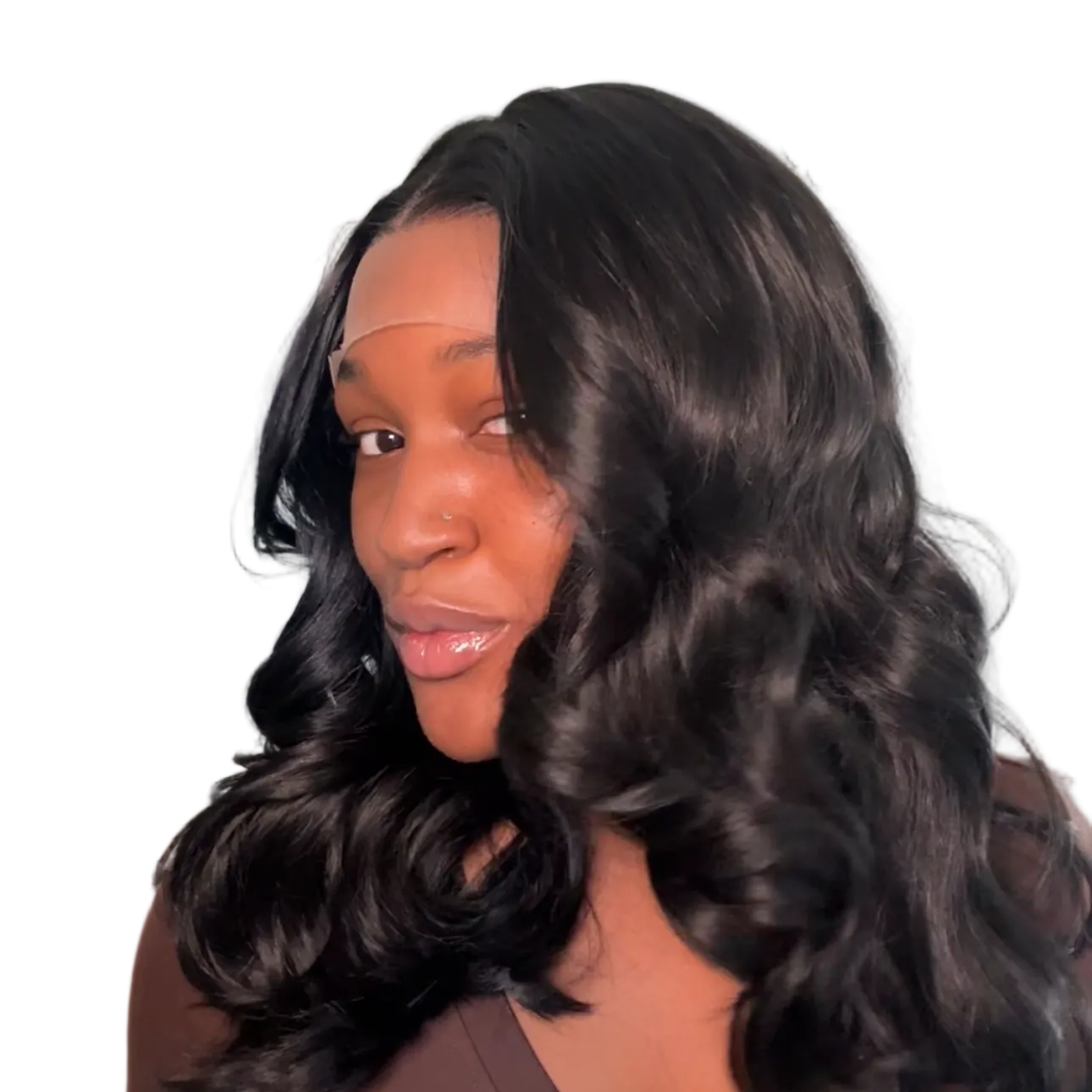 Woman with long, wavy hair wearing a brown top against a neutral background
